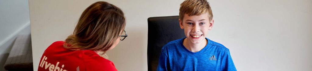 Occupational Therapist works with young boy