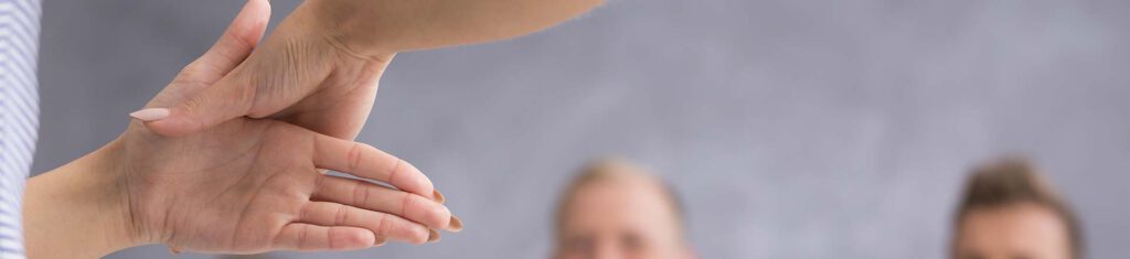 A woman doing sign language